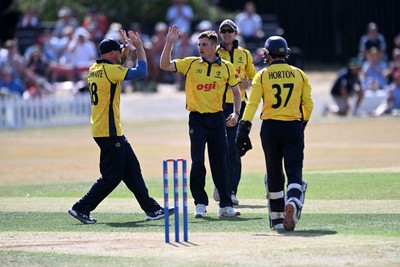 240726 - Glamorgan v Yorkshire - Metro Bank One Day Cup Men - Andy Gorvin of Glamorgan bowls the ball to dismiss George Hill of Yorkshire