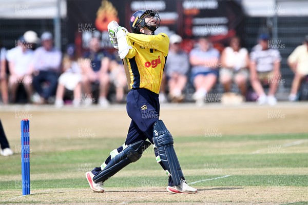 240726 - Glamorgan v Yorkshire - Metro Bank One Day Cup Men - Eddie Byrom of Glamorgan hits a ball high and it is caught by Dom Bess of Yorkshire