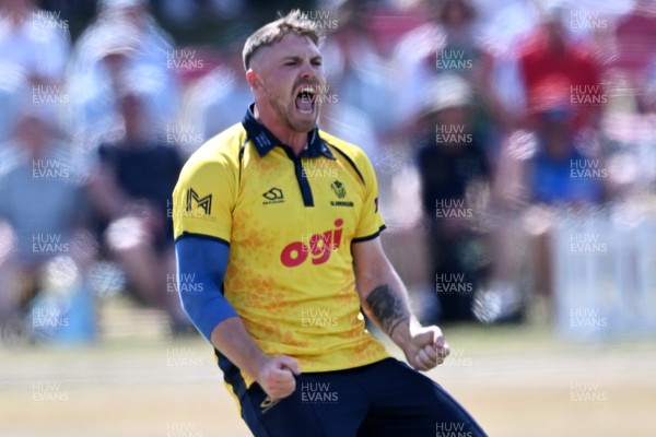 240726 - Glamorgan v Yorkshire - Metro Bank One Day Cup Men - Dan Douthwaite of Glamorgan bowls the ball to dismiss Will Bennison of Yorkshire