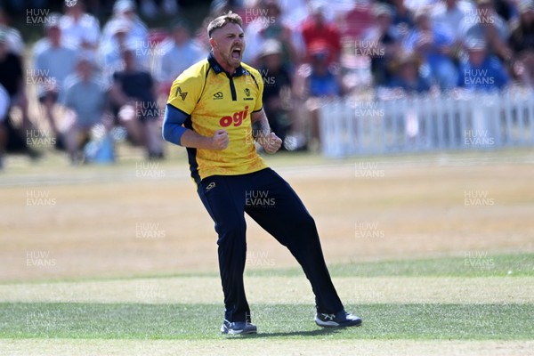 240726 - Glamorgan v Yorkshire - Metro Bank One Day Cup Men - Dan Douthwaite of Glamorgan bowls the ball to dismiss Will Bennison of Yorkshire