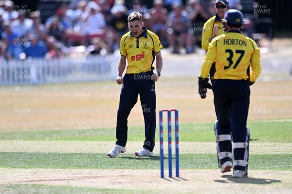 240726 - Glamorgan v Yorkshire - Metro Bank One Day Cup Men - Andy Gorvin of Glamorgan bowls the ball to dismiss George Hill of Yorkshire