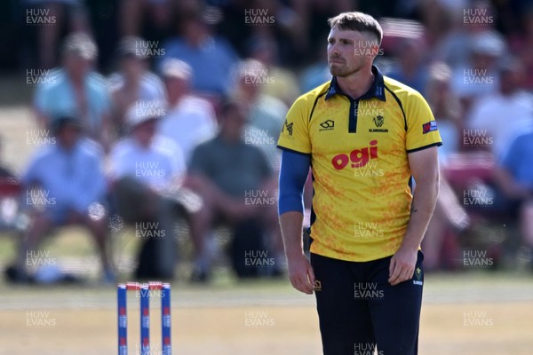 240726 - Glamorgan v Yorkshire - Metro Bank One Day Cup Men - Dan Douthwaite of Glamorgan bowling