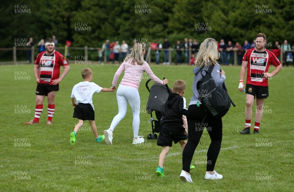 180519 - Glamorgan Wanderers v Brecon RFC - WRU Championship Play off - Women with young children run onto the pitch get escape the fight which broke out amongst the fans