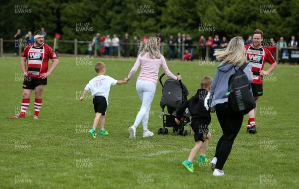 180519 - Glamorgan Wanderers v Brecon RFC - WRU Championship Play off - Women with young children run onto the pitch get escape the fight which broke out amongst the fans