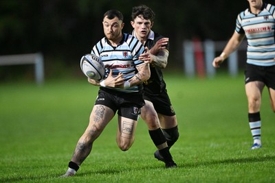 040926 - Glamorgan Wanderers v Mountain Ash - Championship East - Jack Morgan of Glamorgan is challenged by Jamie Long of Mountain Ash