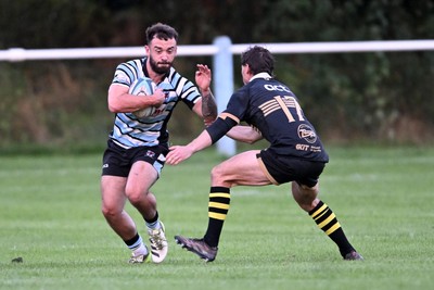 040926 - Glamorgan Wanderers v Mountain Ash - Championship East - Reagan Moore of Glamorgan is challenged by Nathan Evans of Mountain Ash