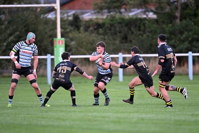 040926 - Glamorgan Wanderers v Mountain Ash - Championship East - Ashley Bissett of Glamorgan is challenged by Jamie Long of Mountain Ash