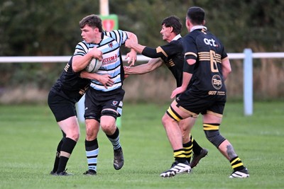 040926 - Glamorgan Wanderers v Mountain Ash - Championship East - Ashley Bissett of Glamorgan is challenged by Jamie Long of Mountain Ash
