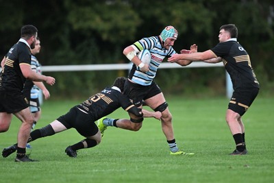 040926 - Glamorgan Wanderers v Mountain Ash - Championship East - Anthony Cox of Glamorgan is challenged by Jamie Long of Mountain Ash