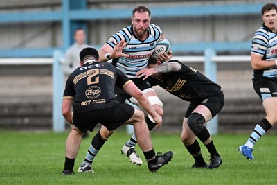 040926 - Glamorgan Wanderers v Mountain Ash - Championship East - Shaun O'Rourke of Glamorgan is challenged by Kieran Coomer of Mountain Ash