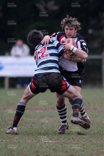 28.02.09 Glamorgan Wanderers RFC. vs. Pontypridd RFC. Principality Premiership, The Memorial Ground, Ely, Cardiff. 
 
Kristian Baller is wrapped up in the tackle by Gareth Morris. 
 
