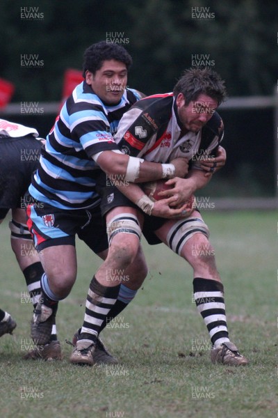 28.02.09 Glamorgan Wanderers RFC. vs. Pontypridd RFC. Principality Premiership, The Memorial Ground, Ely, Cardiff. 
 
Ponty captain Nathan Strong(R) is wrapped up by Nio Aiono. 
 
