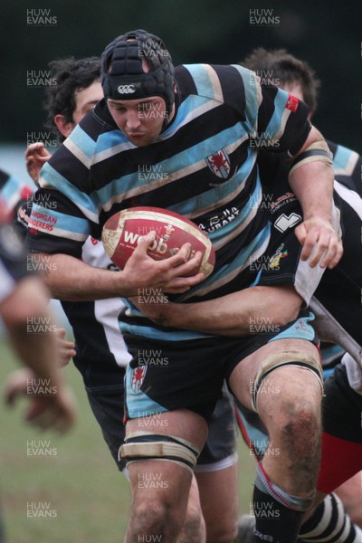 28.02.09 Glamorgan Wanderers RFC. vs. Pontypridd RFC. Principality Premiership, The Memorial Ground, Ely, Cardiff. 
 
Gareth Knight goes on a charge as Adam Thomas hangs on in the tackle. 
 
