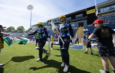 230526 - Glamorgan Women v Derbyshire Falcons Women, Vitality Blast Women League 2 - Lauren Parfitt of Glamorgan Women and Daisy Jeanes of Glamorgan Women make their way out at the start of the match