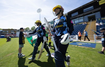 230526 - Glamorgan Women v Derbyshire Falcons Women, Vitality Blast Women League 2 - Lauren Parfitt of Glamorgan Women and Daisy Jeanes of Glamorgan Women make their way out at the start of the match