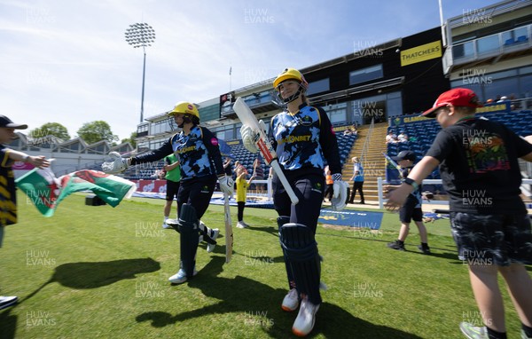 230526 - Glamorgan Women v Derbyshire Falcons Women, Vitality Blast Women League 2 - Lauren Parfitt of Glamorgan Women and Daisy Jeanes of Glamorgan Women make their way out at the start of the match