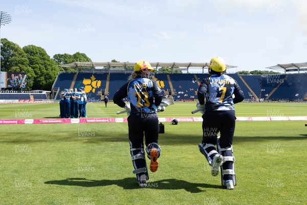 230526 - Glamorgan Women v Derbyshire Falcons Women, Vitality Blast Women League 2 - Lauren Parfitt of Glamorgan Women and Daisy Jeanes of Glamorgan Women make their way out at the start of the match