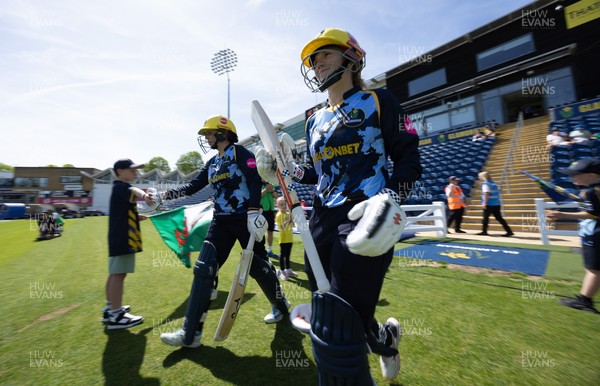 230526 - Glamorgan Women v Derbyshire Falcons Women, Vitality Blast Women League 2 - Lauren Parfitt of Glamorgan Women and Daisy Jeanes of Glamorgan Women make their way out at the start of the match