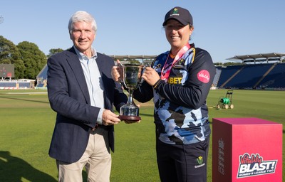 120726 - Glamorgan Women v Gloucestershire Women, Vitality Blast Women League 2 Final - Lauren Parfitt of Glamorgan Women is  presented with the trophy by Alan Wilkins, President of Glamorgan Cricket Club