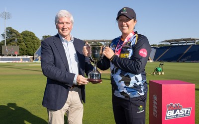 120726 - Glamorgan Women v Gloucestershire Women, Vitality Blast Women League 2 Final - Lauren Parfitt of Glamorgan Women is  presented with the trophy by Alan Wilkins, President of Glamorgan Cricket Club