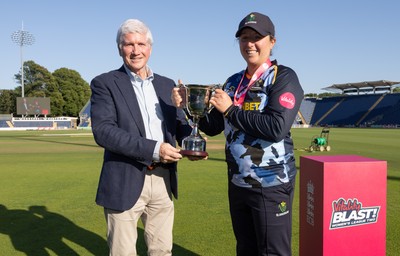 120726 - Glamorgan Women v Gloucestershire Women, Vitality Blast Women League 2 Final - Lauren Parfitt of Glamorgan Women is  presented with the trophy by Alan Wilkins, President of Glamorgan Cricket Club