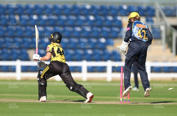 120726 - Glamorgan Women v Gloucestershire Women, Vitality Blast Women League 2 Final - Caitlin Belcher of Gloucestershire Women is bowled by Nicole Reid of Glamorgan Women