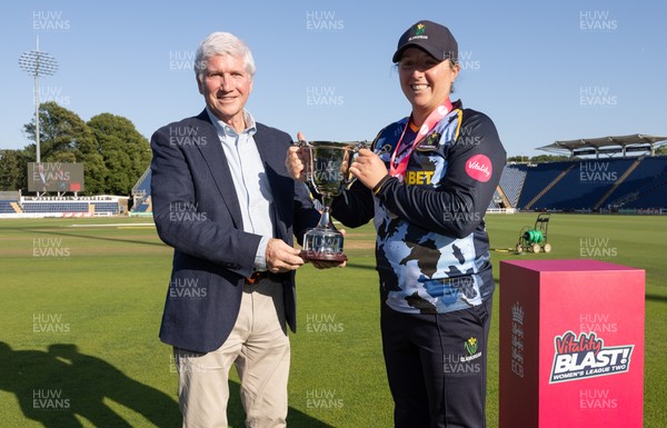 120726 - Glamorgan Women v Gloucestershire Women, Vitality Blast Women League 2 Final - Lauren Parfitt of Glamorgan Women is  presented with the trophy by Alan Wilkins, President of Glamorgan Cricket Club