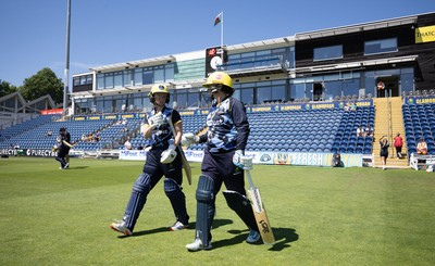 130725 -  Glamorgan Women v Gloucestershire Women, Vitality Blast Women League 2, South Group - Opening batters Bethan Ellis of Glamorgan Women and Lauren Parfitt of Glamorgan Women make their way to the wicket
