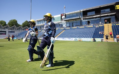 130725 -  Glamorgan Women v Gloucestershire Women, Vitality Blast Women League 2, South Group - Opening batters Bethan Ellis of Glamorgan Women and Lauren Parfitt of Glamorgan Women make their way to the wicket