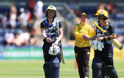 130725 -  Glamorgan Women v Gloucestershire Women, Vitality Blast Women League 2, South Group - Bethan Ellis of Glamorgan Women and Beth Gammon of Glamorgan Women leave the field after their partnership wins the match