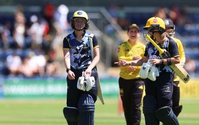 130725 -  Glamorgan Women v Gloucestershire Women, Vitality Blast Women League 2, South Group - Bethan Ellis of Glamorgan Women and Beth Gammon of Glamorgan Women leave the field after their partnership wins the match