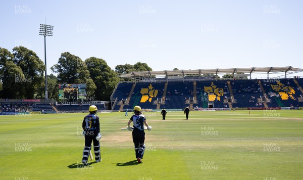 130725 -  Glamorgan Women v Gloucestershire Women, Vitality Blast Women League 2, South Group - Opening batters Bethan Ellis of Glamorgan Women and Lauren Parfitt of Glamorgan Women make their way to the wicket