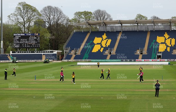 190425 - Glamorgan Women v Sussex Sharks, Metro Bank One Day Cup - Poppy Tulloch of Glamorgan Women bowls Daisy Gibb of Sussex Sharks