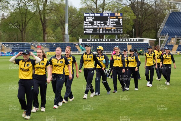 190425 - Glamorgan Women v Sussex Sharks, Metro Bank One Day Cup - Glamorgan Women players leave the pitch at the end of the match after their historic win over Sussex Sharks