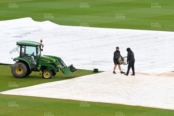 190425 - Glamorgan Women v Sussex Women - Metro Bank One Day Cup - The Groundsmen prepare to clear the field so play can start