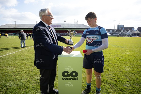 280426 - Glantaf v Y Pant, Boys Year 9 Final - Glantaf captain Will Evans receives the trophy from Roy Bergiers after they win the Boys Year 9 Final