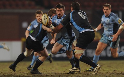 19.02.10 - Glasgow v Cardiff Blues - Magners League - Ceri Sweeney of Cardiff Blues is tackled by James Eddie of Glasgow. 