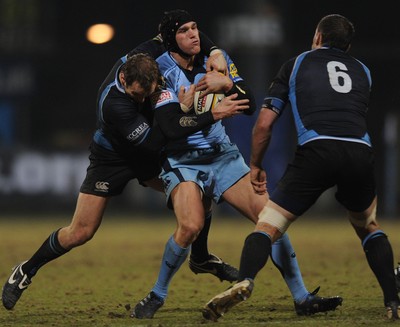 19.02.10 - Glasgow v Cardiff Blues - Magners League - Tom James of Cardiff Blues is tackled by Mark McMillan of Glasgow. 