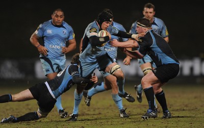 19.02.10 - Glasgow v Cardiff Blues - Magners League - Ben White of Cardiff Blues holds off Ruaridh Jackson and Jon Welsh of Glasgow. 