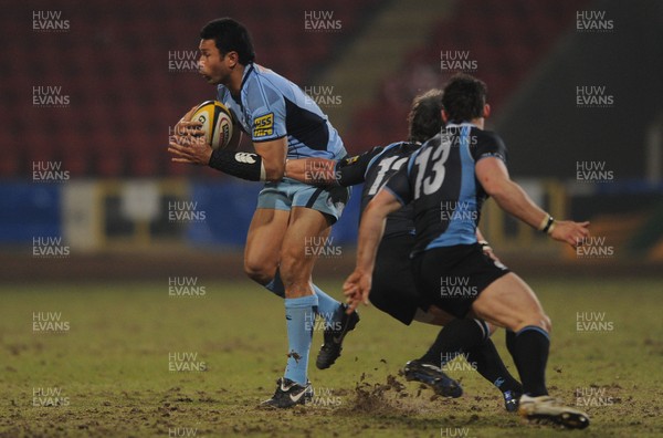 19.02.10 - Glasgow v Cardiff Blues - Magners League - Casey Laulala of Cardiff Blues is tackled by Peter Horne of Glasgow. 