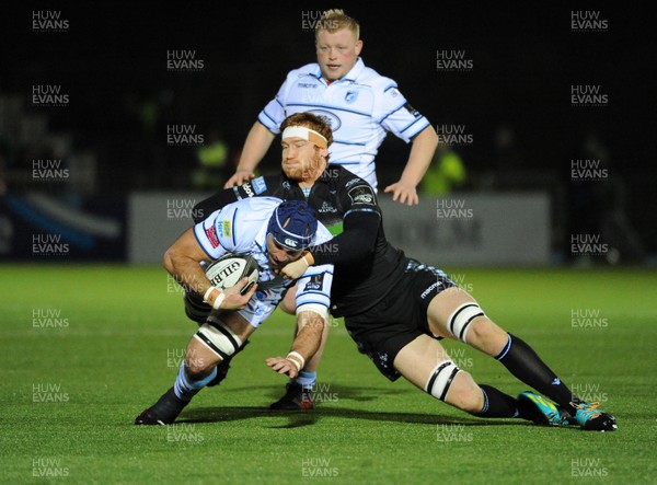 231118 - Glasgow Warriors v Cardiff Blues - Cardiff Blues' George Earle is tackled by Glasgow's Rob Harley � Huw Evans Agency