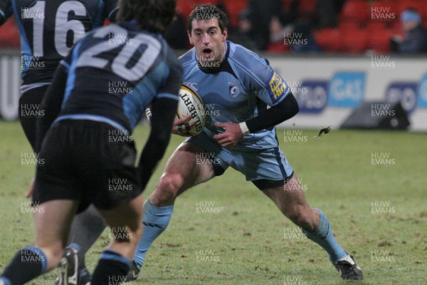 28.11.08 Glasgow Warriors vs. Cardiff Blues. Magners League. Firhill Arena, Glasgow. 
 
Dafydd Hewitt takes evassive action as Eric Milligan(16) & Hefin O'Hare(20) close in. 
 
