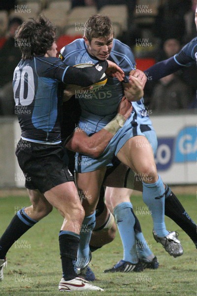 28.11.08 Glasgow Warriors vs. Cardiff Blues. Magners League. Firhill Arena, Glasgow. 
 
Richard Mustoe is stopped by the tackles of Hefin O'Hare(20) & Kelly Brown. 
 
