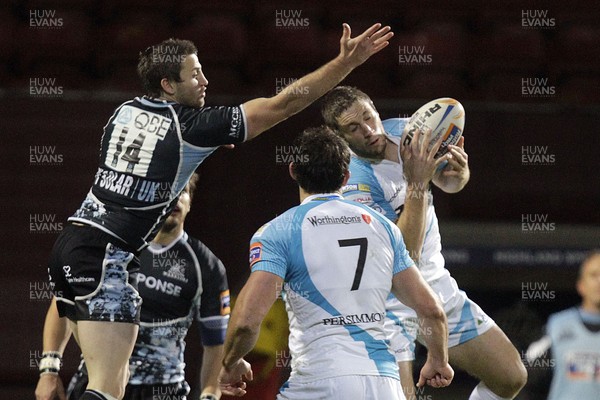 28.10.11 - Glasgow v Ospreys - RaboDirect Pro 12 Ospreys' Andrew Bishop (R) is challenged by Glasgow Warriors' Tommy Seymour (L) 