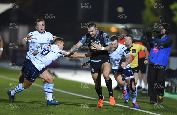 121019 - Glasgow Warriors v Cardiff Blues - Guinness PRO14 -  Rory Hughes of Glasgow tackled by Jarrod Evans of Cardiff