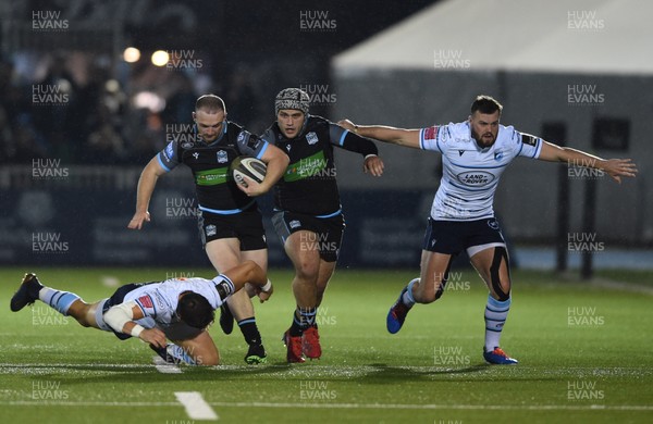 121019 - Glasgow Warriors v Cardiff Blues - Guinness PRO14 -  Nick Grigg of Glasgow tackled by Lloyd Williams of Cardiff