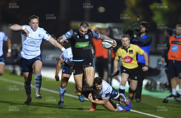 121019 - Glasgow Warriors v Cardiff Blues - Guinness PRO14 -  Rory Hughes of Glasgow tackled by Jarrod Evans and Owen Lane of Cardiff