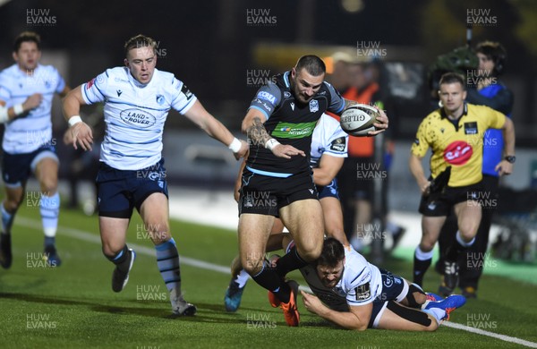 121019 - Glasgow Warriors v Cardiff Blues - Guinness PRO14 -  Rory Hughes of Glasgow tackled by Jarrod Evans and Owen Lane of Cardiff