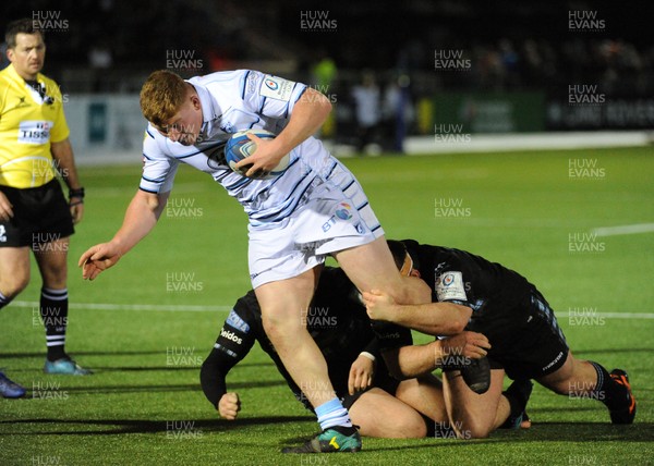120119 - Glasgow Warriors v Cardiff Blues - Guinness PRO14 -  Rhys Carre of Cardiff causes havoc in the Glasgow defence driving for the line, as he is tackled by Grant Stewart and Darcy Rae (R)