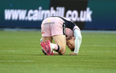 080526 - Glasgow Warriors v Cardiff Rugby - United Rugby Championship - Josh Adams of Cardiff lays unconcussed after a hard collison with Sione Tuipulotu